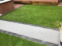 Completed artificial lawn installation by Decorative Stone Driveways